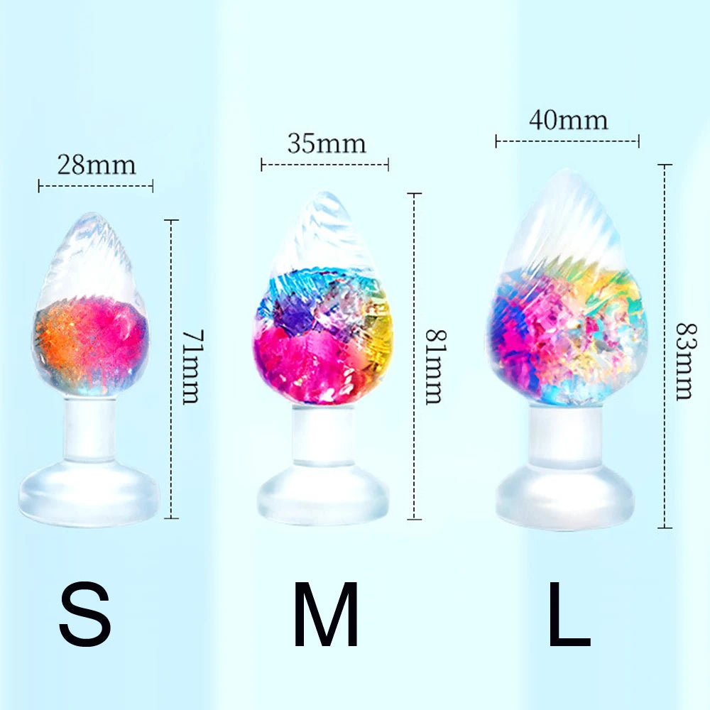Three rainbow silicone anal plugs shown in small, medium, and large sizes with measurements