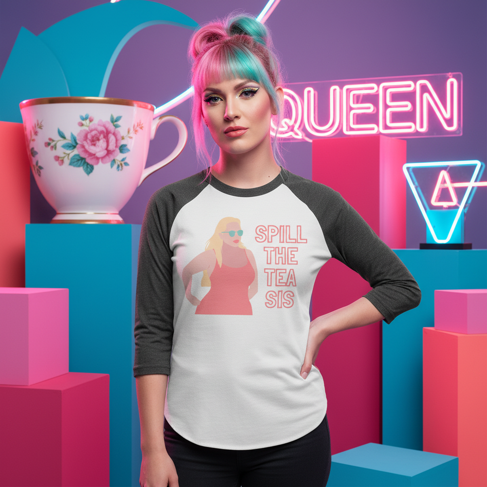 Front-facing model wears a white and charcoal raglan shirt reading “SPILL THE TEA SIS”