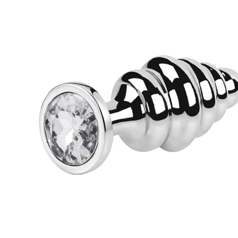 Stainless steel ribbed butt plug with a large faceted jewel at the flared base