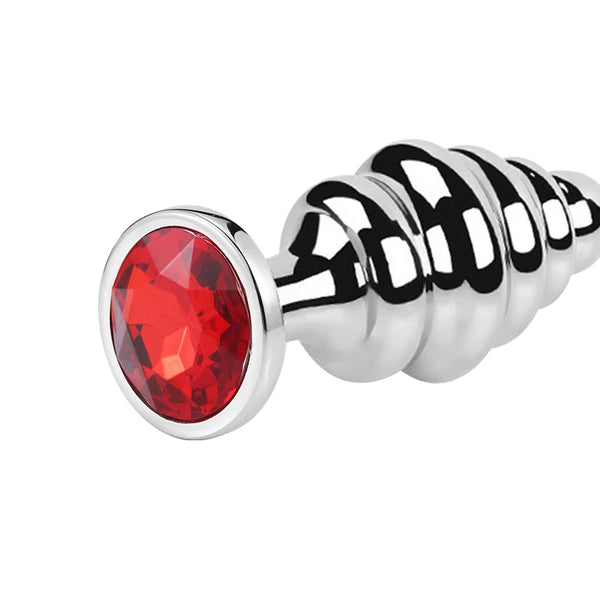 Stainless steel ribbed butt plug with a large faceted red jewel on its base
