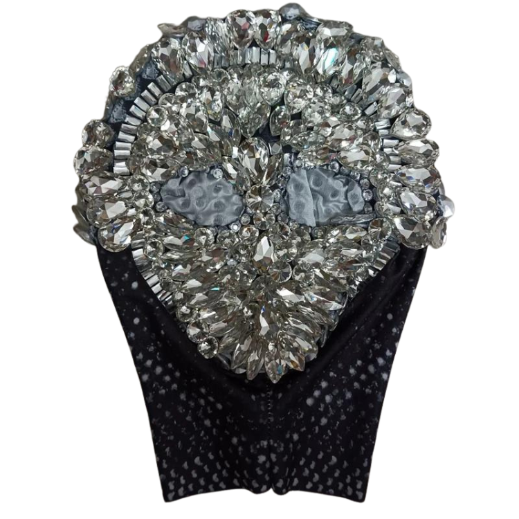 Close-up front view of a black bodysuit with a large heart-shaped rhinestone embellishment