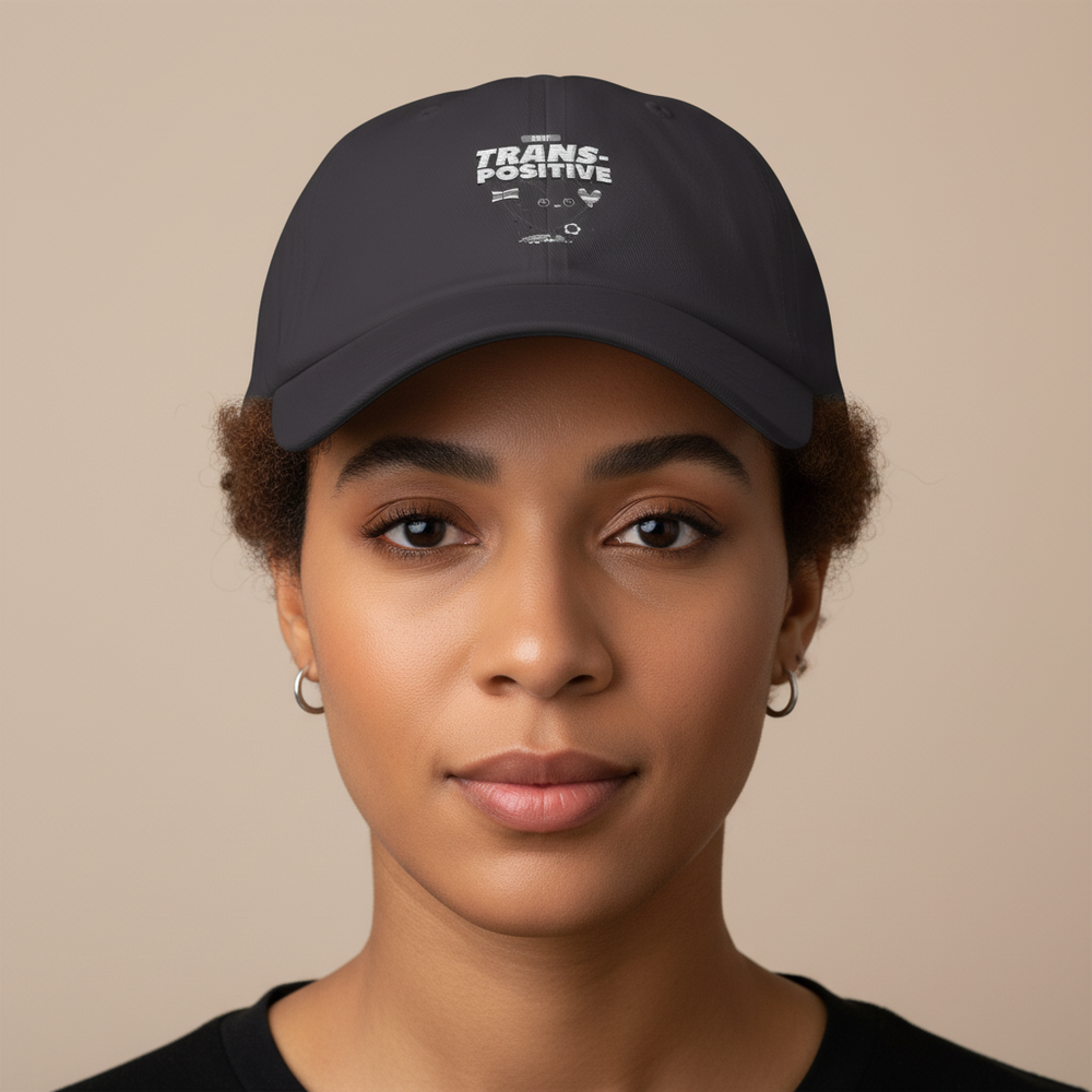 Stay Trans-Positive Cap—black with "TRANS-POSITIVE" in crisp white letters and queer symbols
