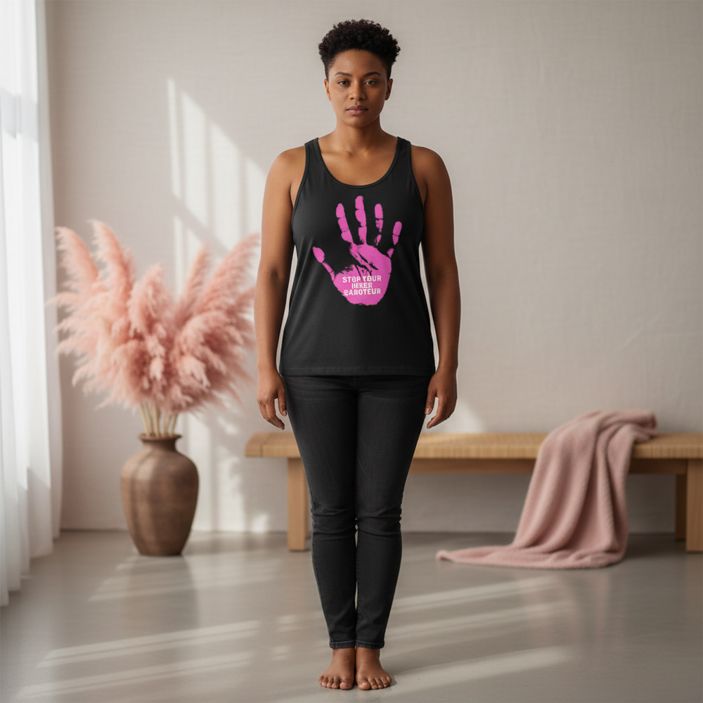 Black unisex tank top reading “Stop Your Inner Saboteur” with bold pink handprint, worn indoors near a window, bench