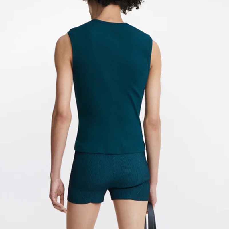 Back view of a person wearing a fitted teal sleeveless top and matching shorts