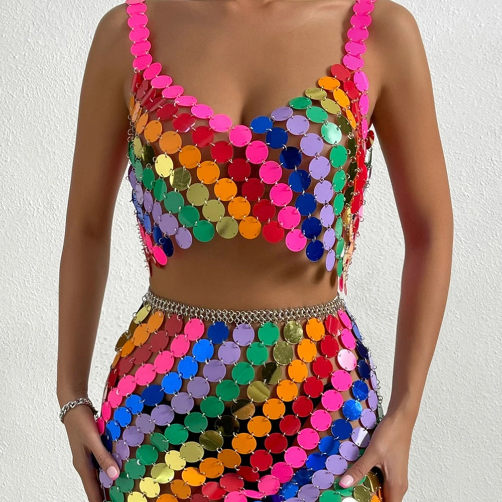 Cropped front view of a model wearing a colorful sequin crop top and matching skirt