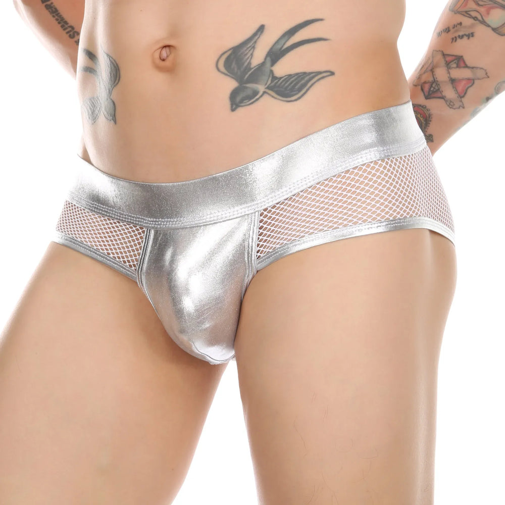 Close-up front view of metallic silver boxer briefs with fishnet side panels on a tattooed model