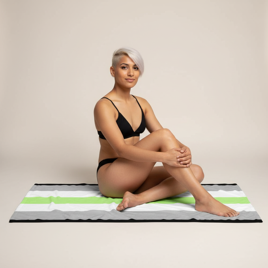 Agender Pride Flag Towel with bold stripes in use: a person with platinum-blonde hair, black bikini, relaxed and confident.
