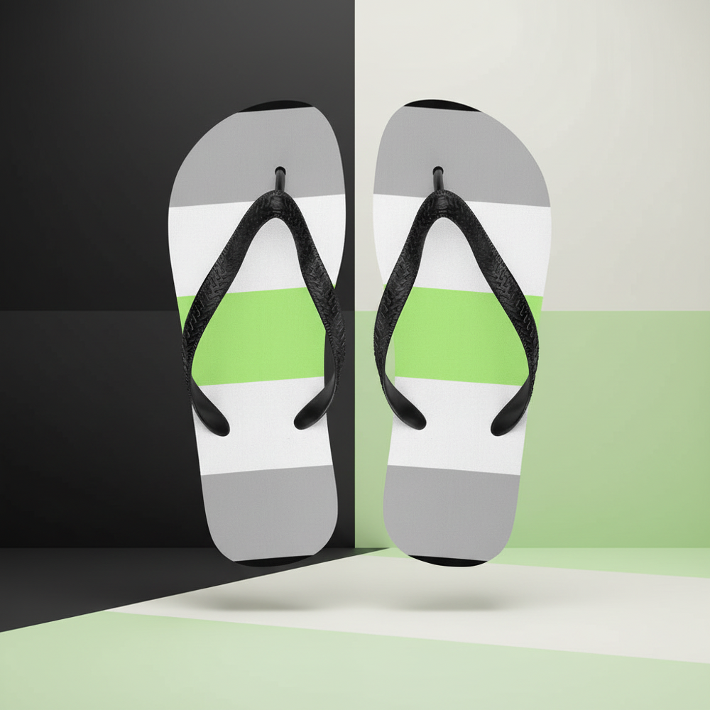 Pair of black-strap flip-flops floating upright, with gray, white, and bright green striped footbeds
