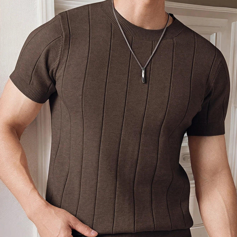 Close-up front view of a person wearing a brown ribbed knit T-shirt with a crew neck