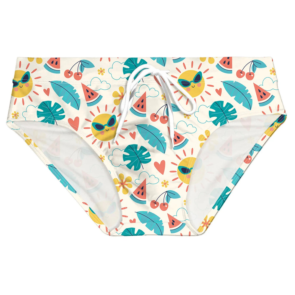 Front view of cream swim briefs with colorful fruit, leaf, flower, heart, and sunglasses-sun print