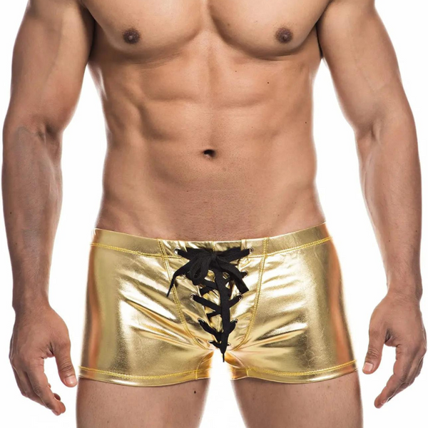 Metallic gold PU-leather boxers with black lace-up drawstring front, modeled from the waist up