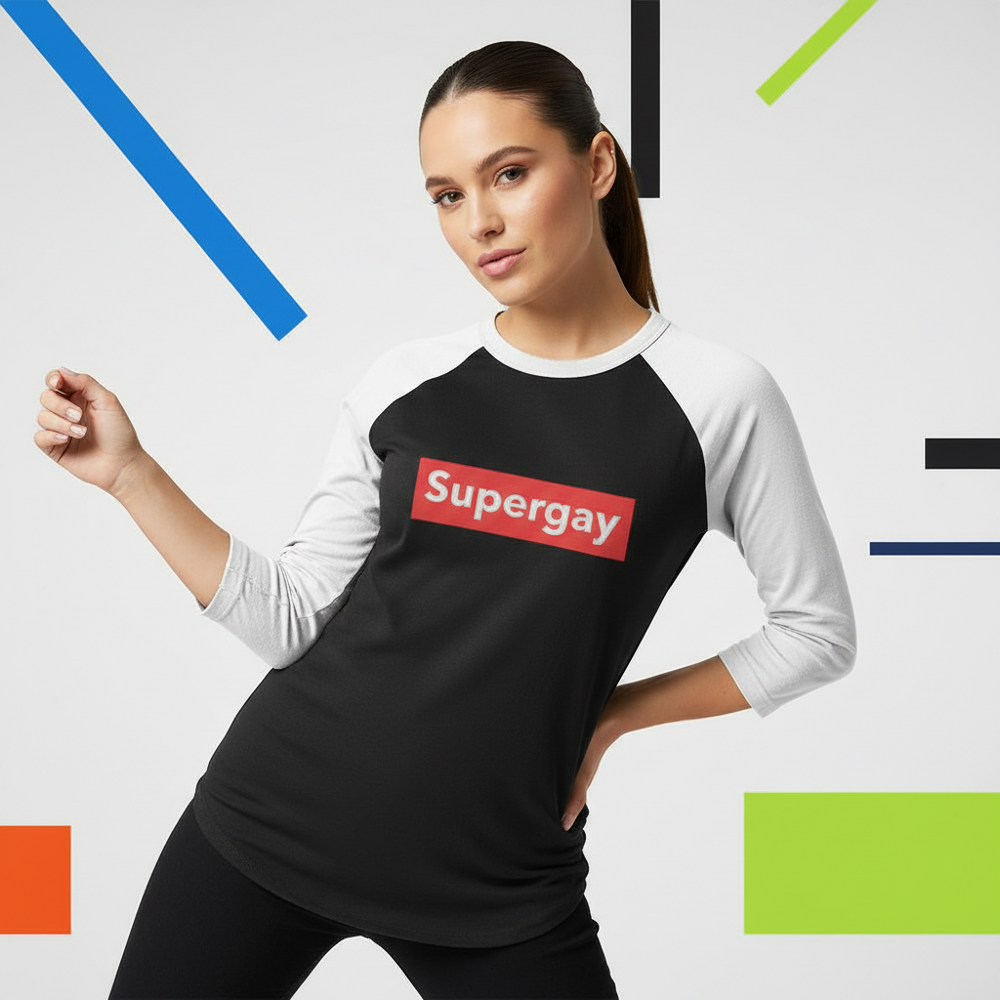 Model wearing a black raglan shirt with white three-quarter sleeves and a red “Supergay” chest graphic