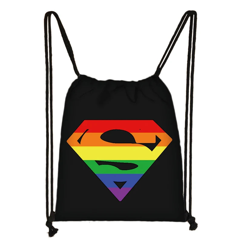 Black drawstring bag with a rainbow Superman-style shield and black masked emblem