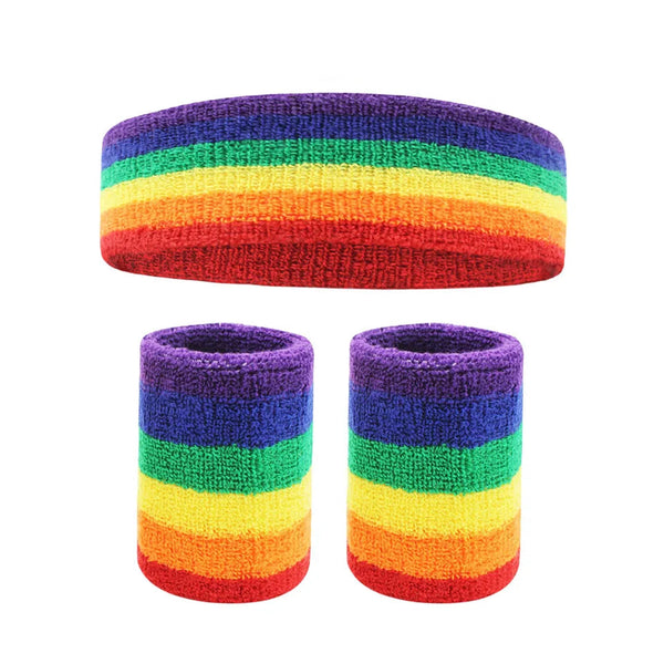 Rainbow-striped terry-cloth headband above two matching wristbands on a white background