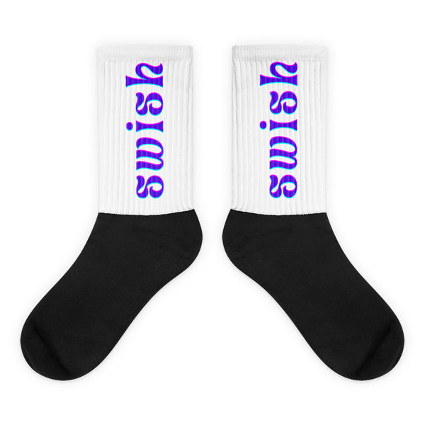 Pair of black-and-white crew socks with colorful vertical “swish” lettering