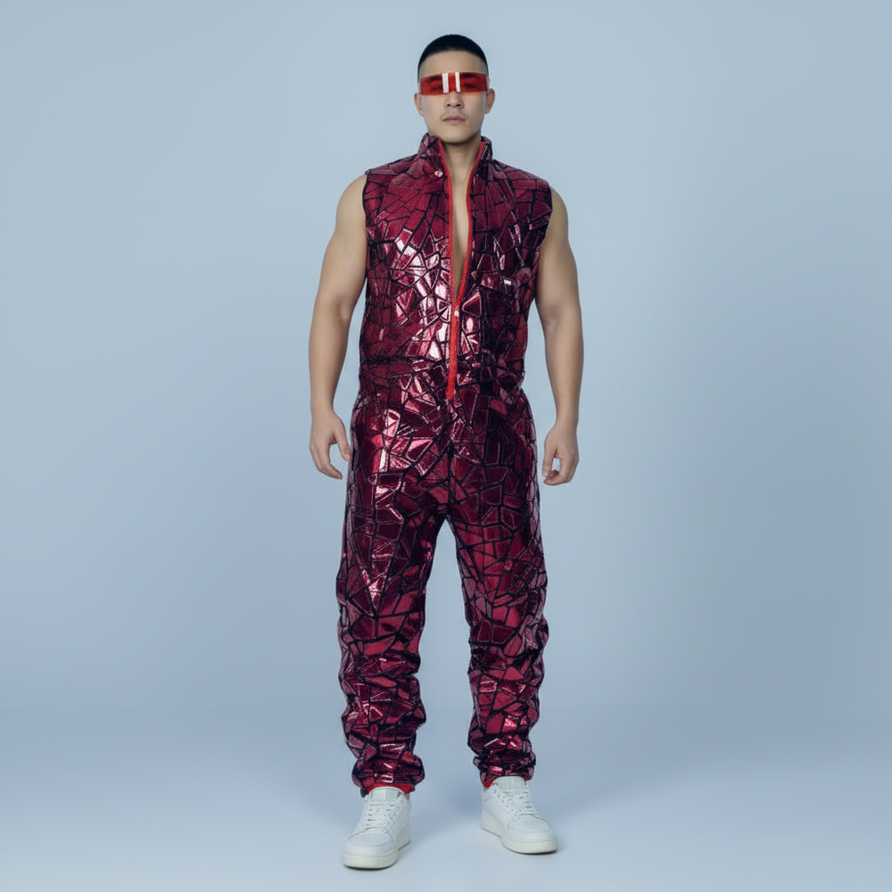Front-view model wearing a sleeveless ruby-red patterned jumpsuit with white sneakers