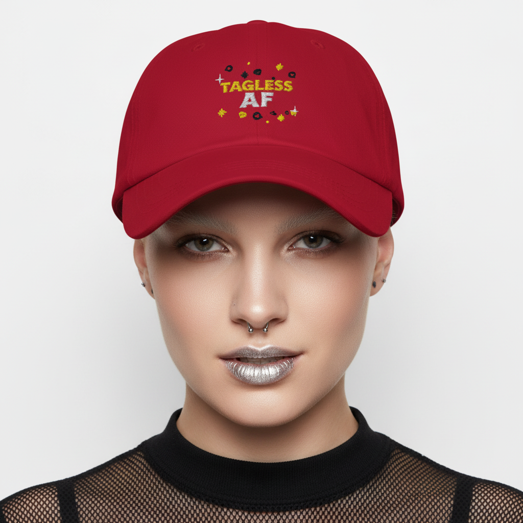 Tagless AF Cap: bold red pride hat with vibrant letters, stars, and circles; paired with black mesh top, septum ring