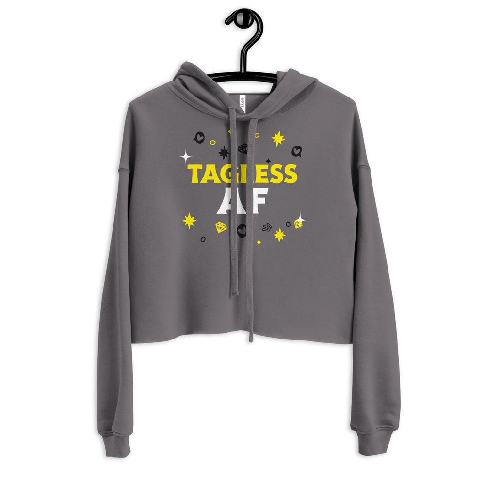 Front view of a gray cropped hoodie on a hanger with yellow and white “TAGLESS AF” text