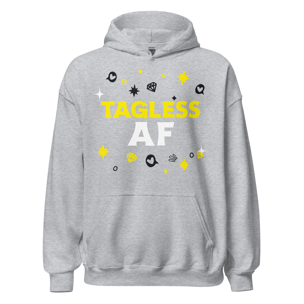 Unisex hoodie in light gray with bold white and yellow "TAGLESS AF" text and queer-coded doodles: stars, hearts, swirls.