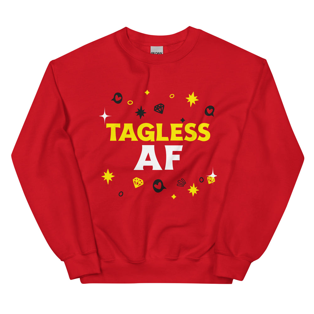 Red unisex crewneck sweatshirt with bold yellow and white "TAGLESS AF" text and playful icons, laid flat. Pride gear for all.
