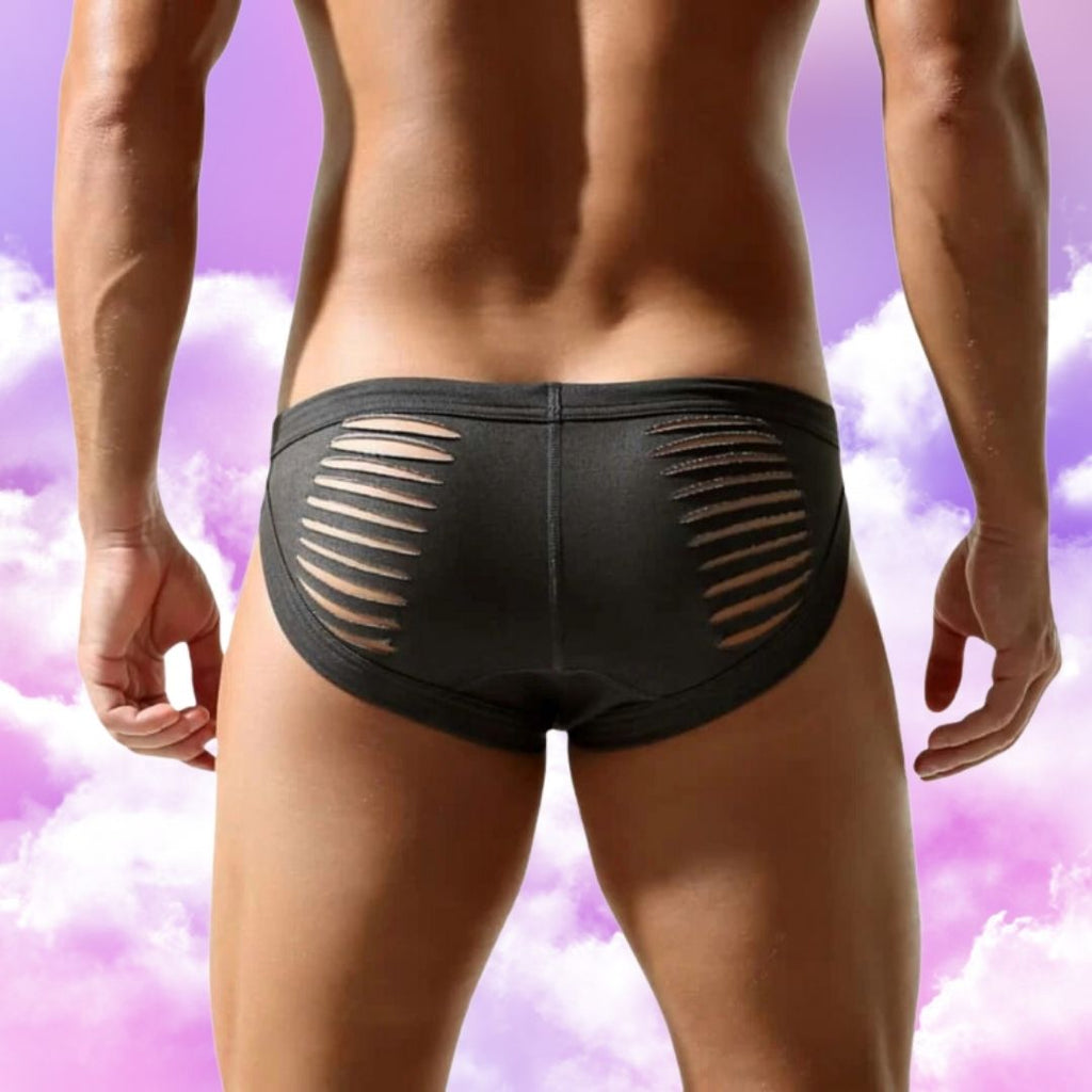 Rear view of a person wearing black low-rise briefs with horizontal side slits