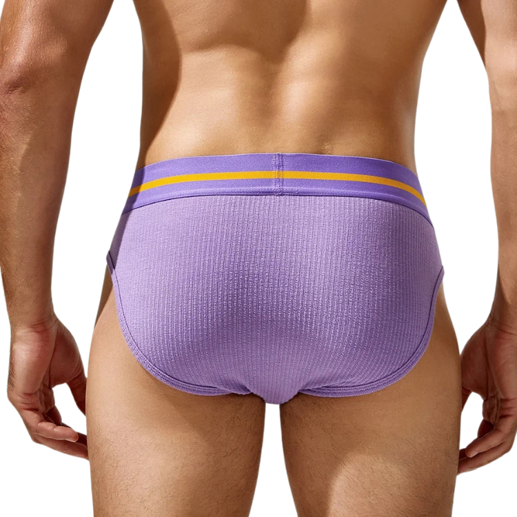 Rear view of a model wearing ribbed lavender briefs with a yellow waistband stripe