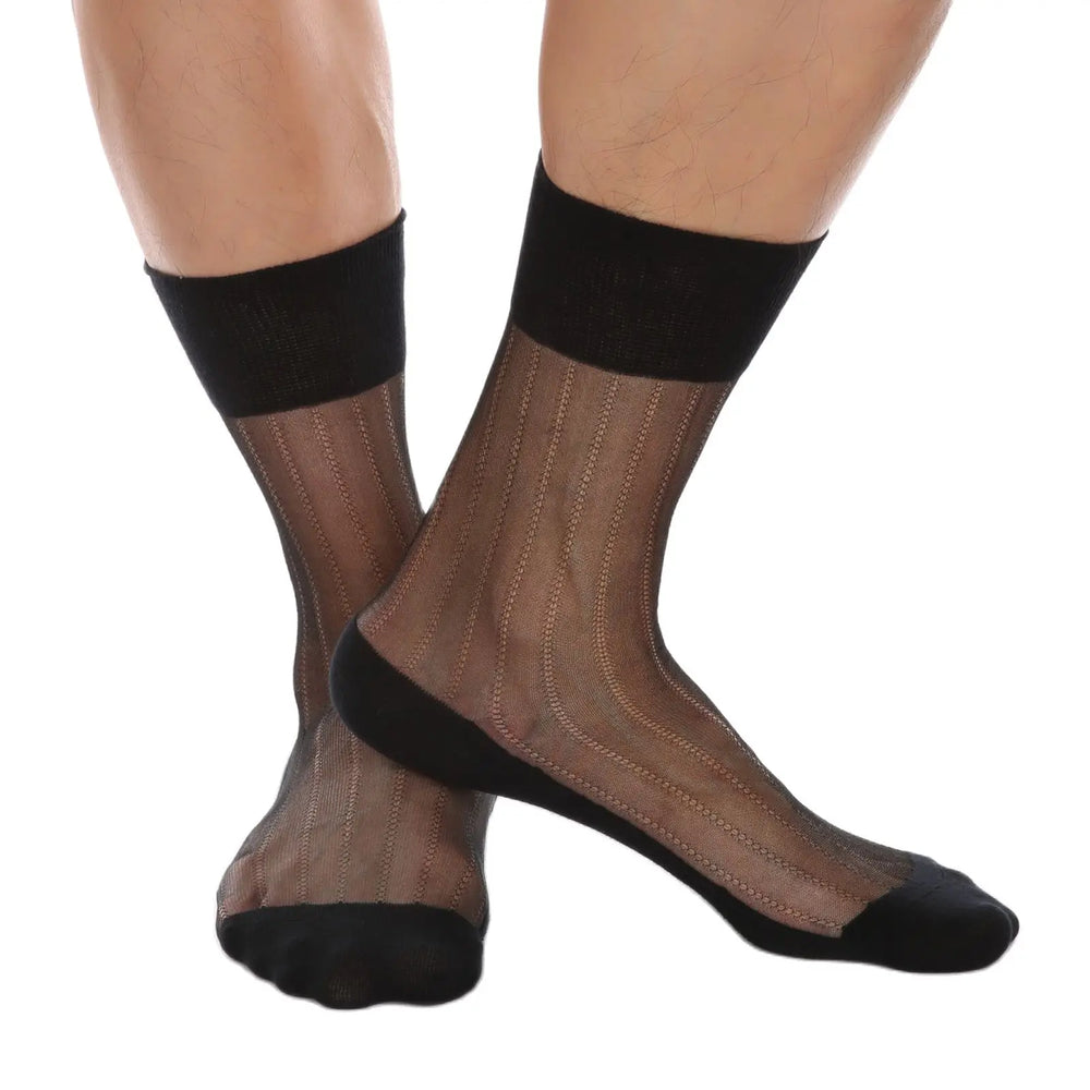 Model wearing sheer black mesh ankle socks with vertical textured stripes and opaque cuffs, heels, and toes