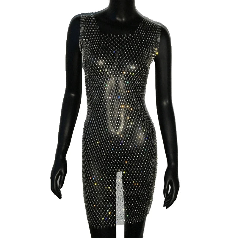 Front view of a black mannequin wearing a sheer crystal mesh cover-up dress