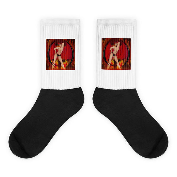 Pair of black-and-white socks with a red, horned devil illustration on each cuff