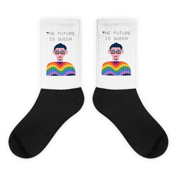 Pair of black-and-white crew socks reading “THE FUTURE IS QUEER” with rainbow-shirt illustrations