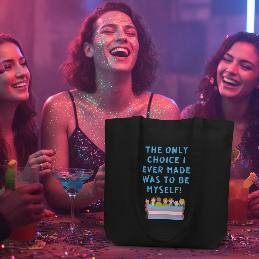 Eco tote bag with "The Only Choice I Ever Made" in bold, trans pride flag, on a club table