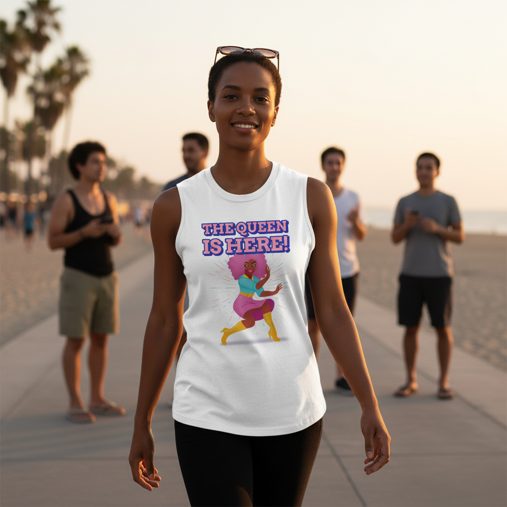 The Queen Is Here Muscle Top with bold, vibrant lettering and a fierce person graphic; model on sunny beach path