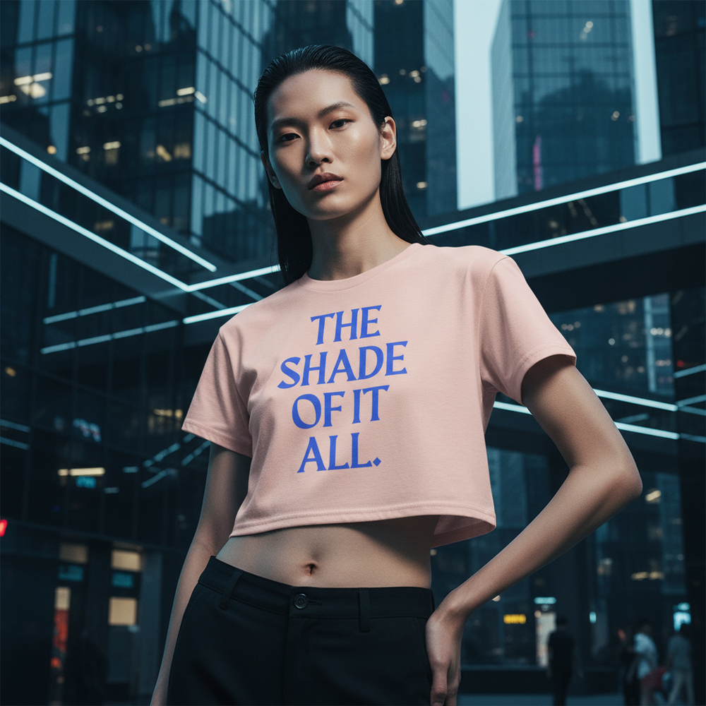 The Shade Of It All Crop Top, a relaxed-fit light pink tee with bold blue text