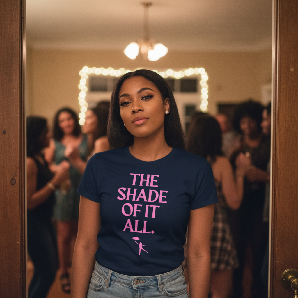 The Shade Of It All T-Shirt, a navy blue unisex top with bold pink lettering