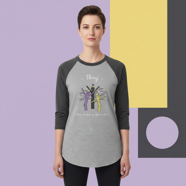 Front view of a model wearing a gray raglan shirt reading “They” and “Non-binary friends!”