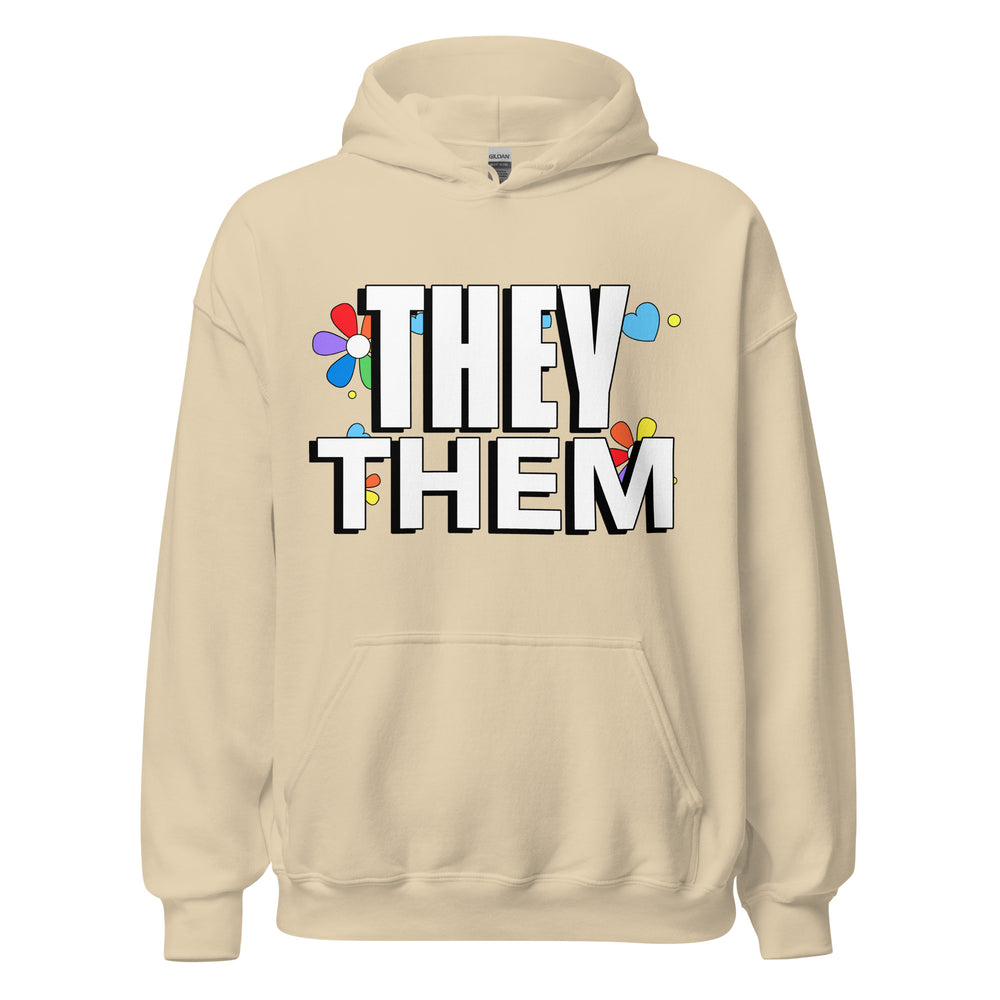 Front view of a light beige hoodie reading “THEY THEM” with colorful petals and dots