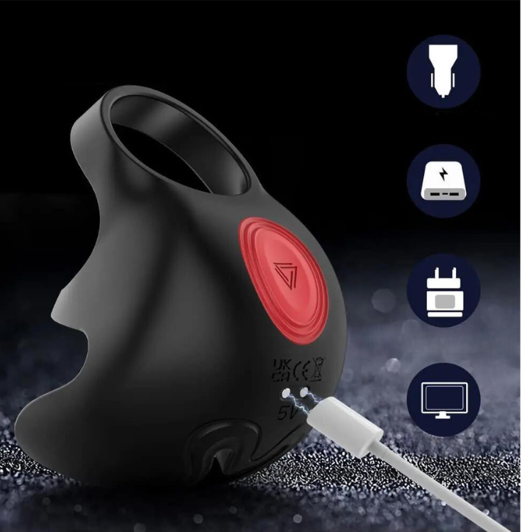 Black penis and testicle ring massager with red button and charging cable attached