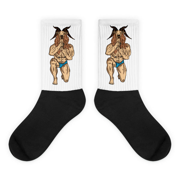 Pair of black-and-white crew socks with muscular goat figures in blue briefs
