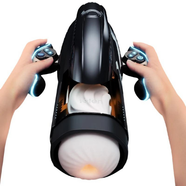 Black automatic masturbator held upright with two illuminated handheld controllers