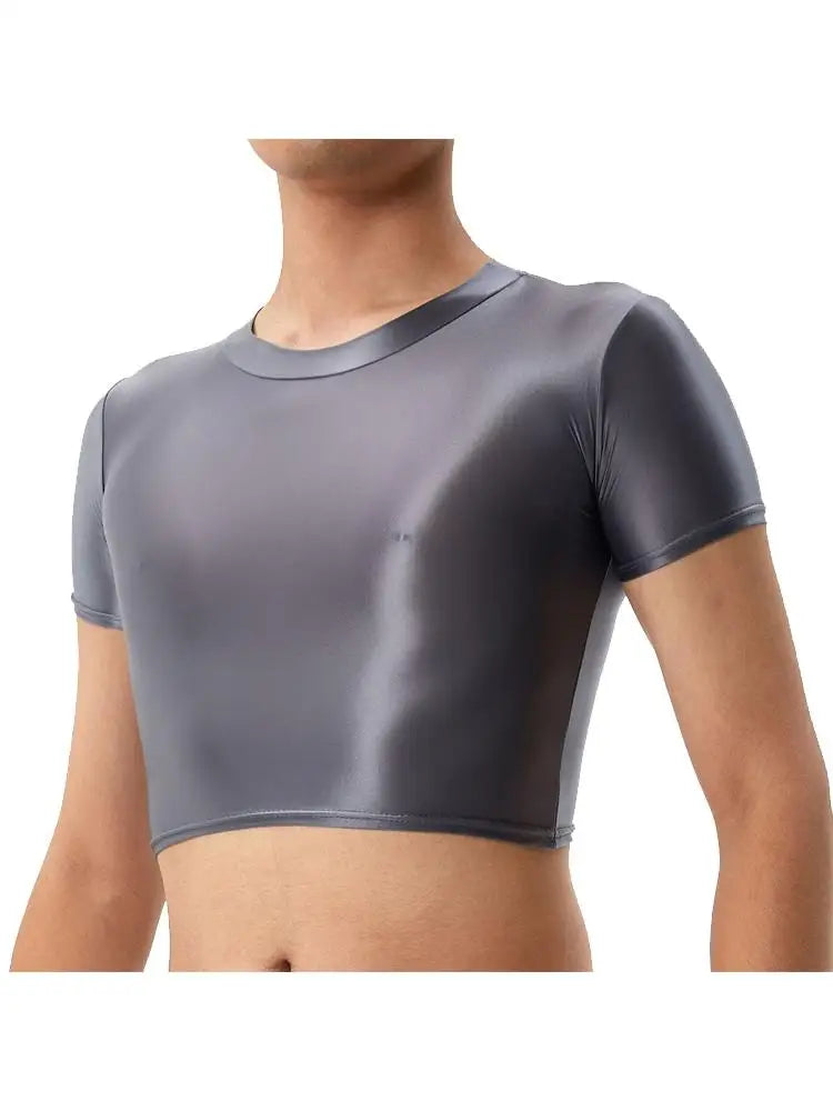 Front view of a model wearing a fitted charcoal gray short-sleeve crop top