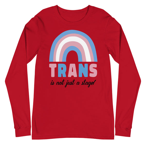 Front view of a red long-sleeve shirt with a pastel rainbow and “TRANS is not just a stage!”