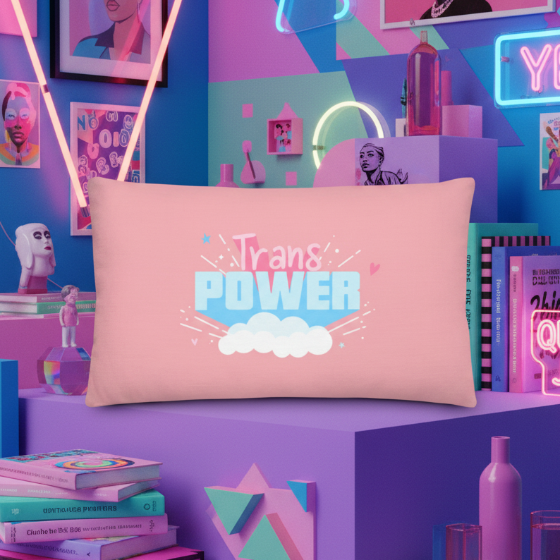 Pastel pink Trans Power Pillow with “Trans POWER” and a white cloud in a neon-lit