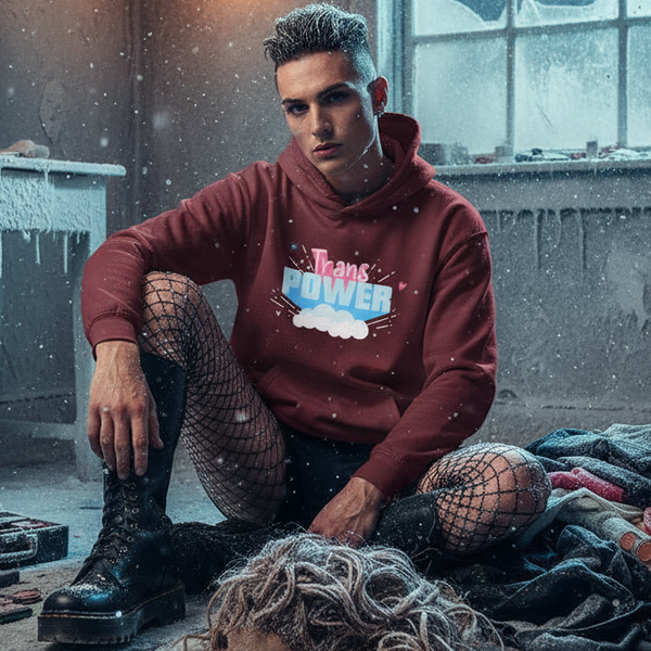 Seated model in maroon hoodie with “Trans POWER” graphic, fishnet tights, and combat boots