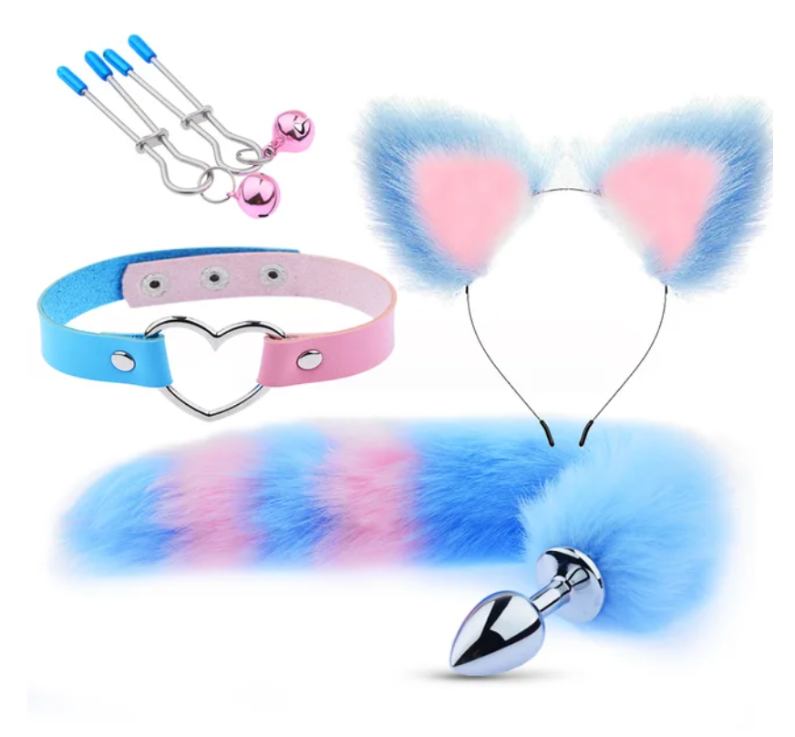 Flat lay of a pastel blue-and-pink pup-play kit with cat ears, heart choker, tail, plug, and clamps