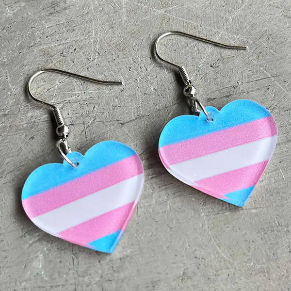 Pair of heart-shaped acrylic dangle earrings in blue, pink, and white stripes