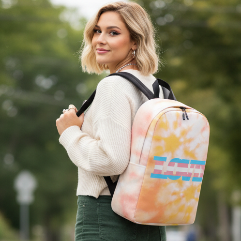 Transgender Love Minimalist Backpack in tie-dye pink and yellow, “LOVE” in bold blue and red