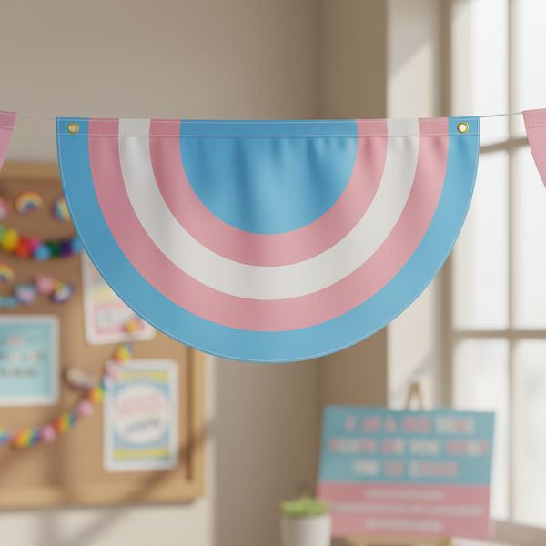 Transgender pride bunting with blue, pink, and white curved stripes hanging on a cord