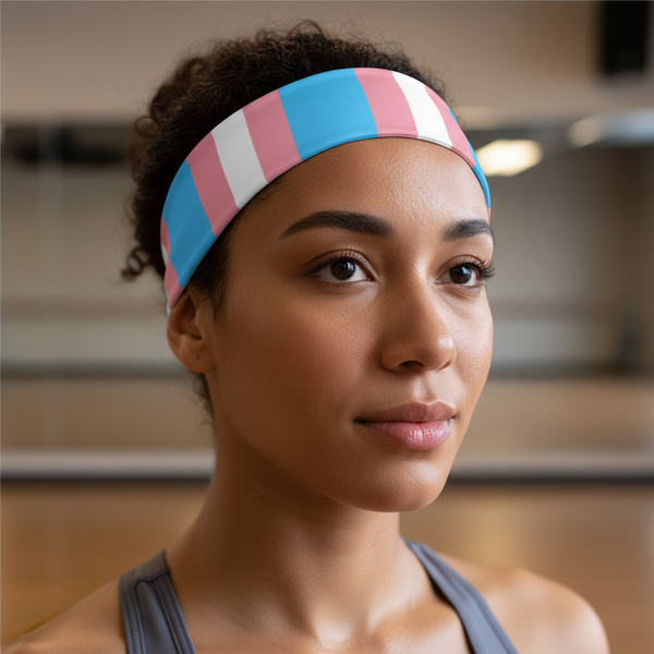 Transgender Pride Headband in pink, blue, and white worn by a curly-haired person in a gray tank top