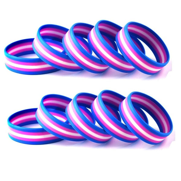 Two rows of blue, pink, and white striped rubber wristbands on a white background