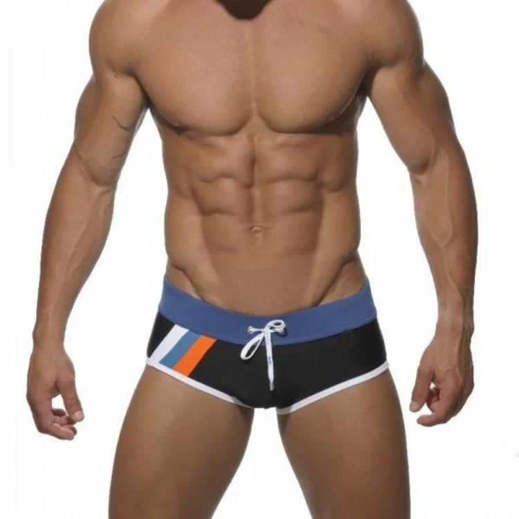 Front-view model wearing black square-cut swim trunks with blue waistband and orange-white side stripes